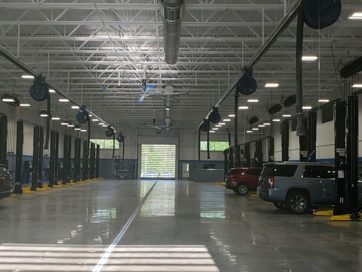 Two-post lifts and overhead reels down the drive