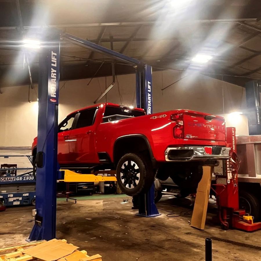 Heavy duty vehicle raised on a lift